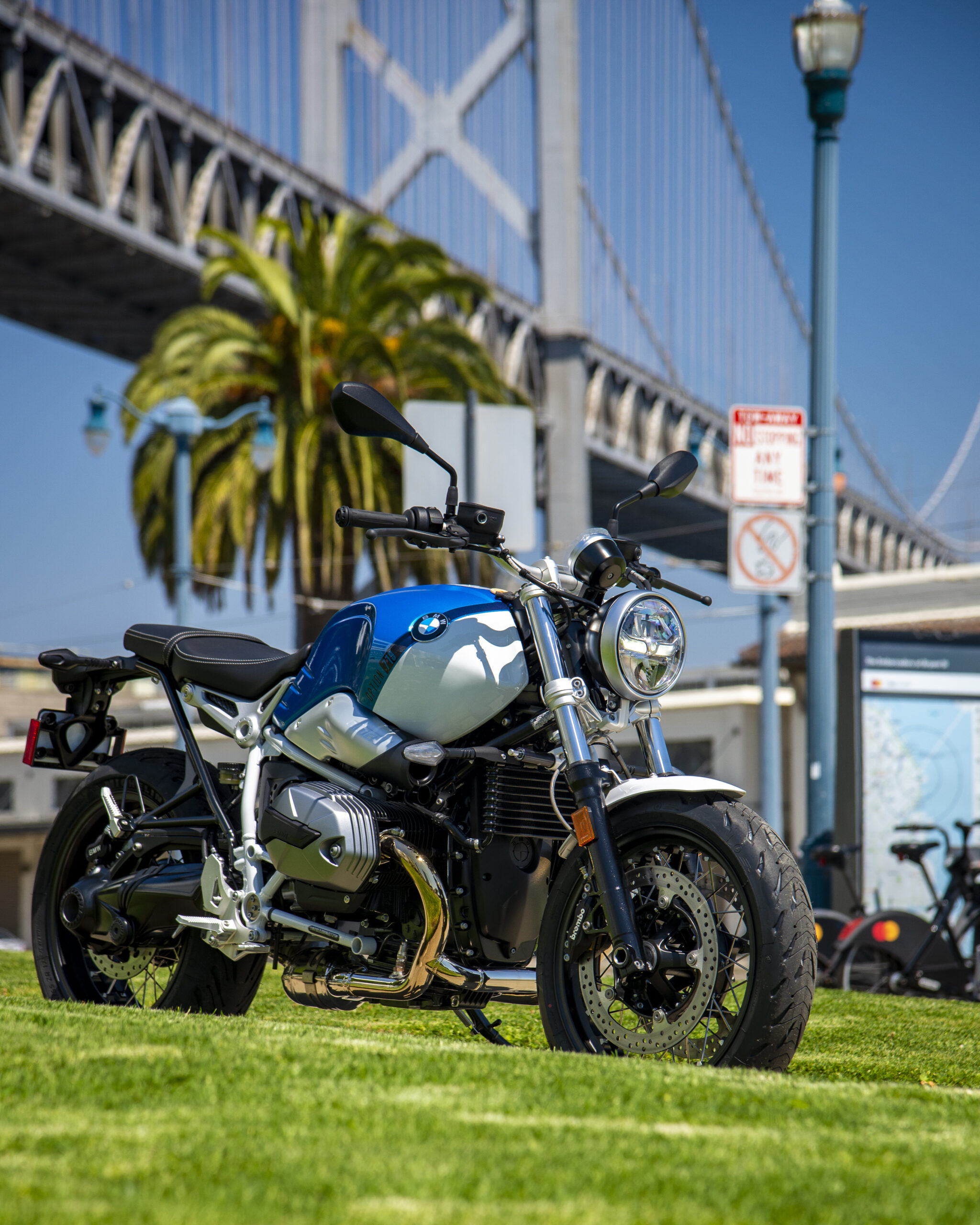 Blue 2023 BMW R nineT in front of Bridge
